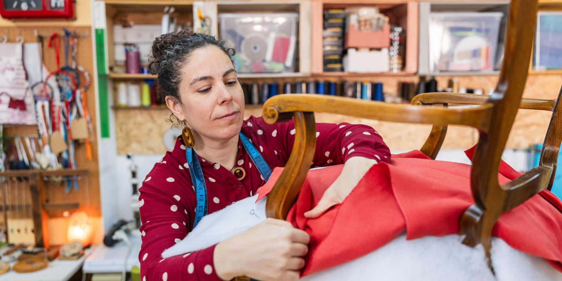 Woman doing chair upholstery