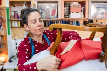 Woman doing chair upholstery