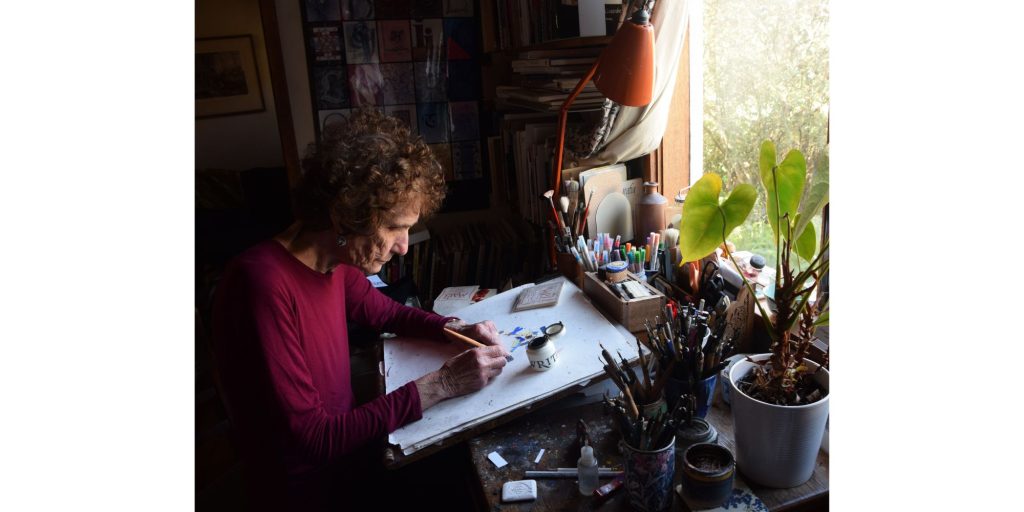 woman teaching calligraphy