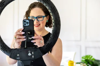 Woman capturing video on mobile phone