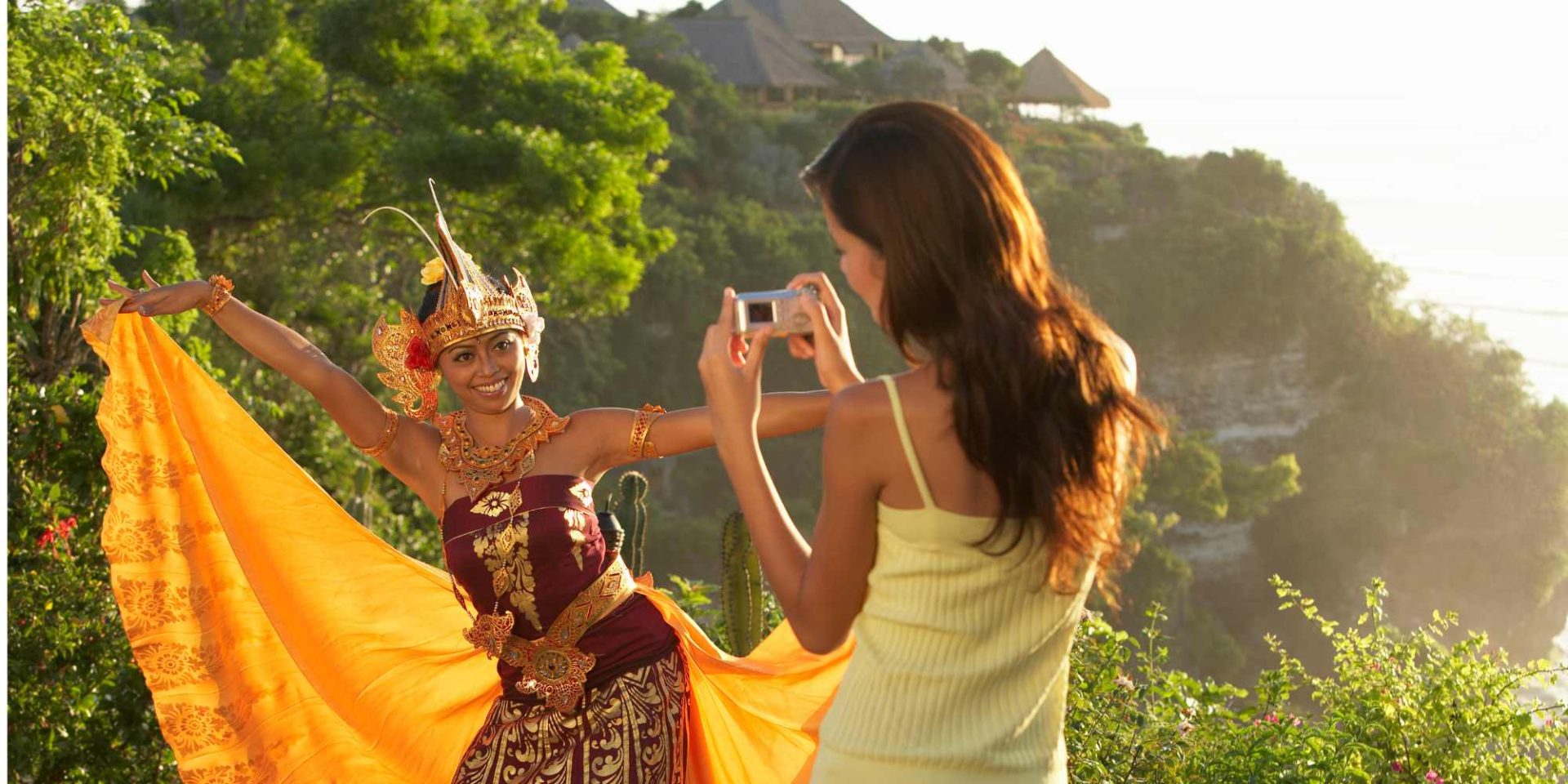 Wonam taking photo od Indonesian woman in national dress