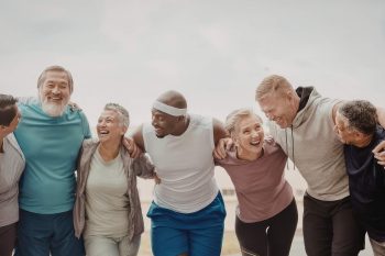 adults laughing during fitness class
