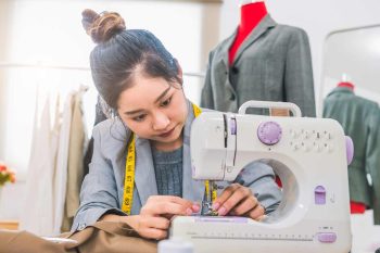 Asian woman sewing