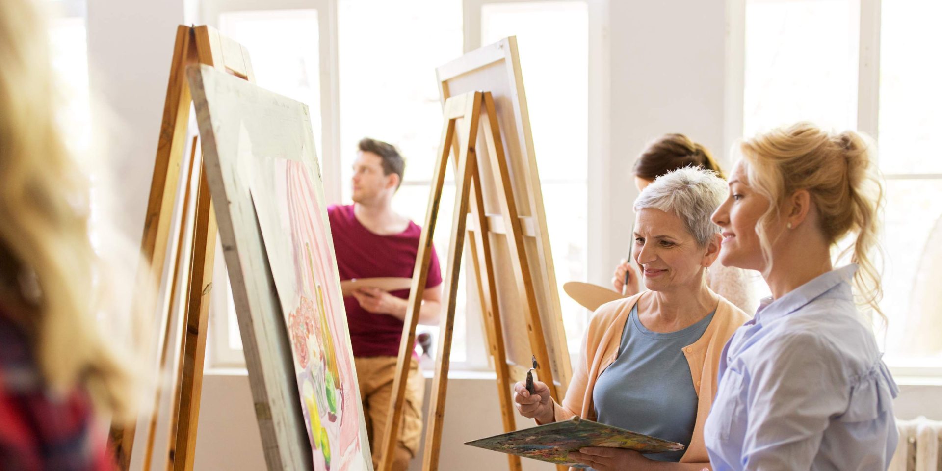 adult women enjoying painting