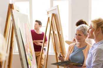 adult women enjoying painting