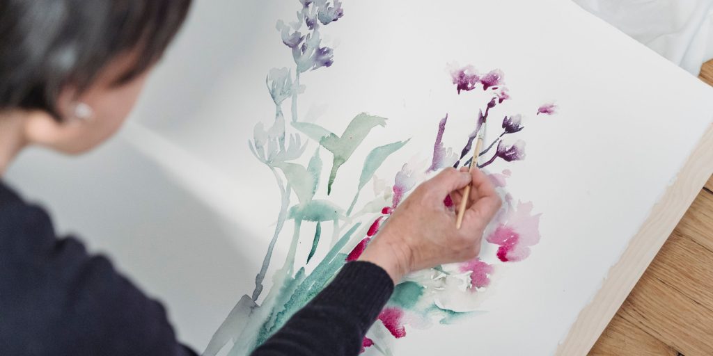 woman painting flowers