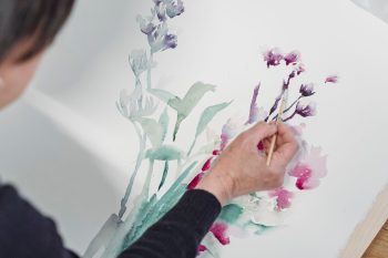 woman painting flowers