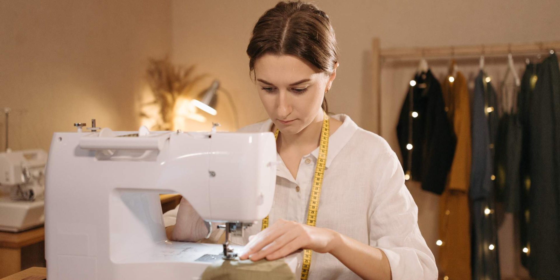 A student adjusting a dress pattern